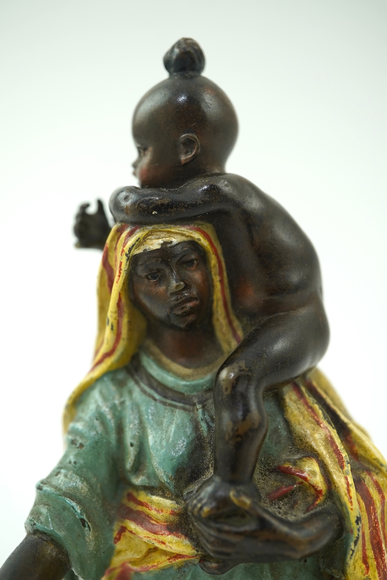 Franz Xavier Bergman (Austrian, 1861-1936). A Viennese cold painted bronze figure of a Moorish female beggar and child
